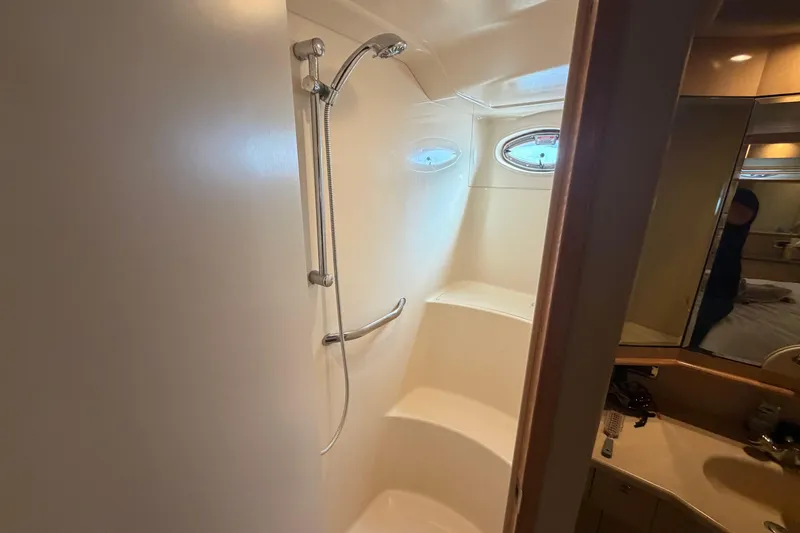 Slide: The Image of Shower area in 2002 Sea Ray 480 Motor Yacht with oval windows and sleek design. - 29