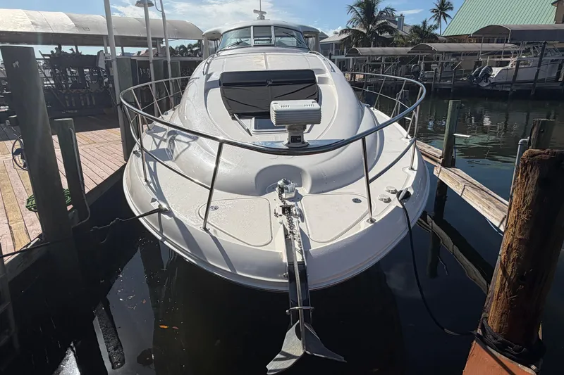 Slide: The Image of 2002 Sea Ray 480 Motor Yacht docked at marina, front view. - 3
