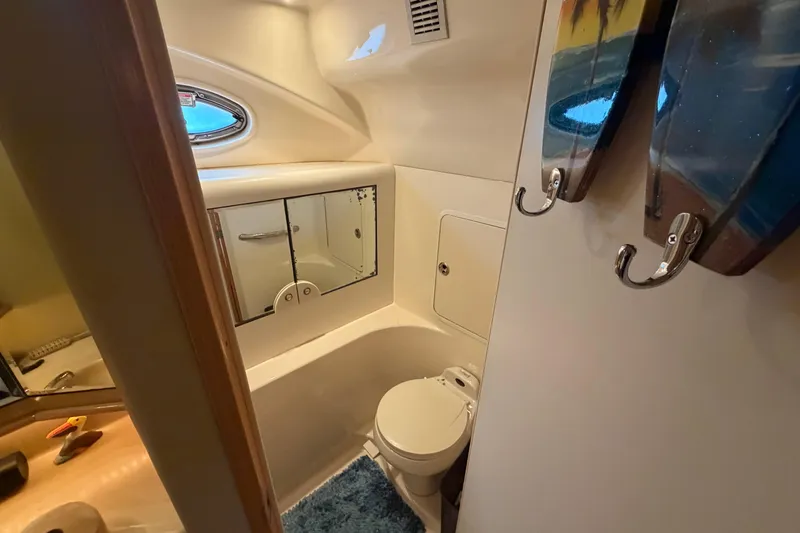 Slide: The Image of Bathroom interior of 2002 Sea Ray 480 Motor Yacht with mirror and toilet. - 30