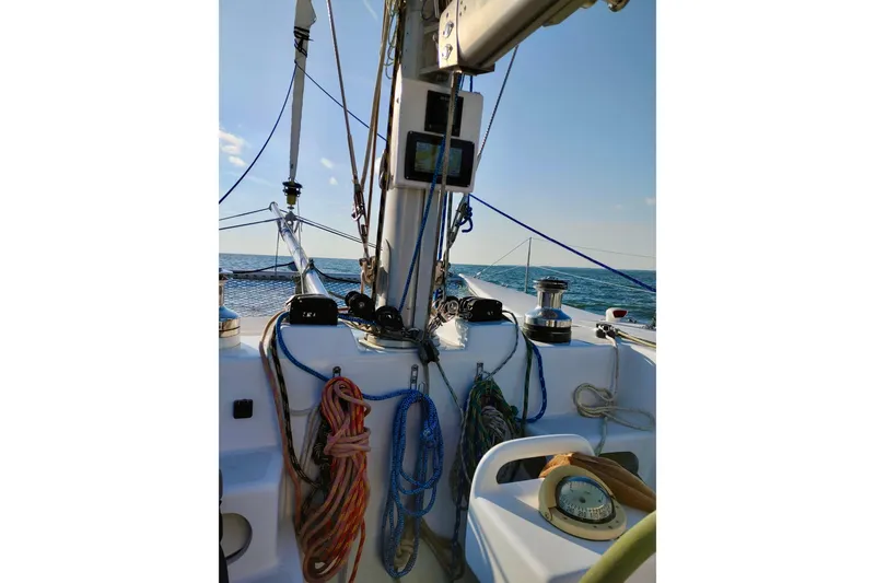 Slide: The Image of Cockpit view of 2003 Chris White Atlantic 42 sailboat with ropes and ocean backdrop. - 10