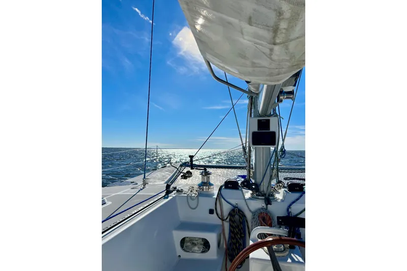 Slide: The Image of Sailing on a 2003 Chris White Atlantic 42 catamaran under clear blue skies. - 13