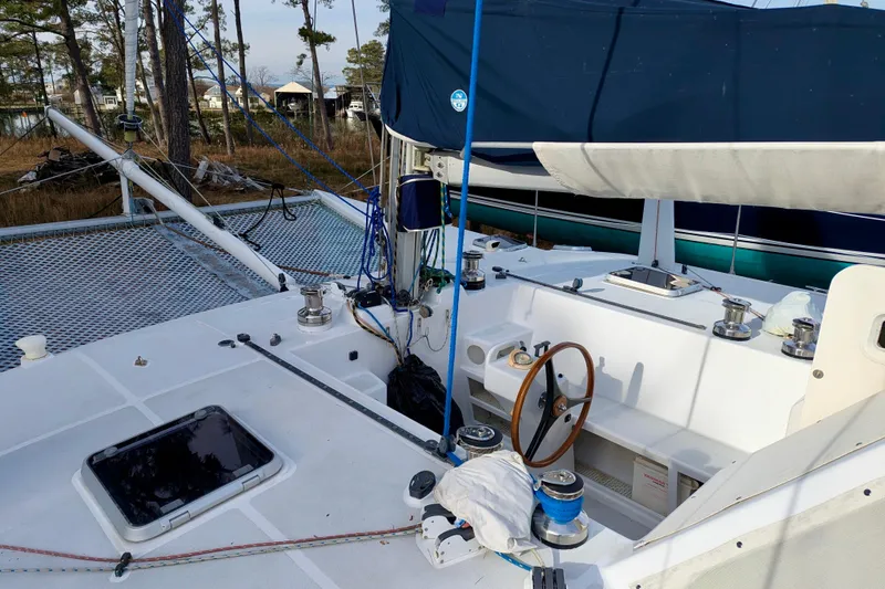 Slide: The Image of 2003 Chris White Atlantic 42 sailboat cockpit with steering wheel and rigging. - 19