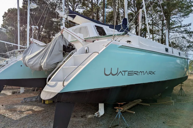 Slide: The Image of 2003 Chris White Atlantic 42 catamaran "Watermark" on land, surrounded by trees. - 29