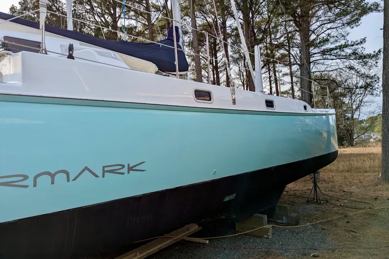 Slide: The Image of 2003 Chris White Atlantic 42 catamaran on land, surrounded by trees. - 30