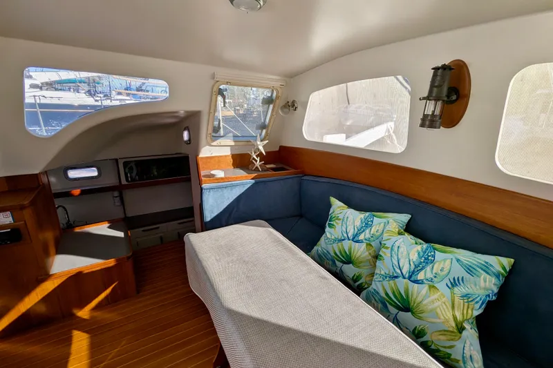 Slide: The Image of Interior of 2003 Chris White Atlantic 42 yacht with cozy seating and nautical decor. - 33