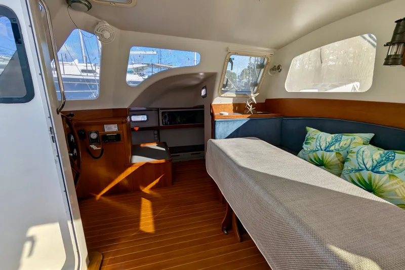 Slide: The Image of Interior of 2003 Chris White Atlantic 42 yacht with cozy seating and nautical decor. - 34