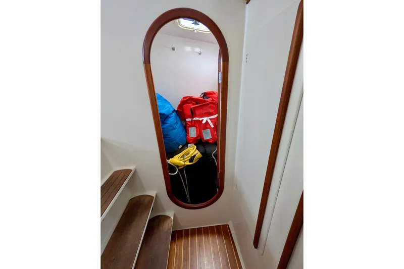 Slide: The Image of Interior of 2003 Chris White Atlantic 42 yacht with mirror and colorful bags. - 46