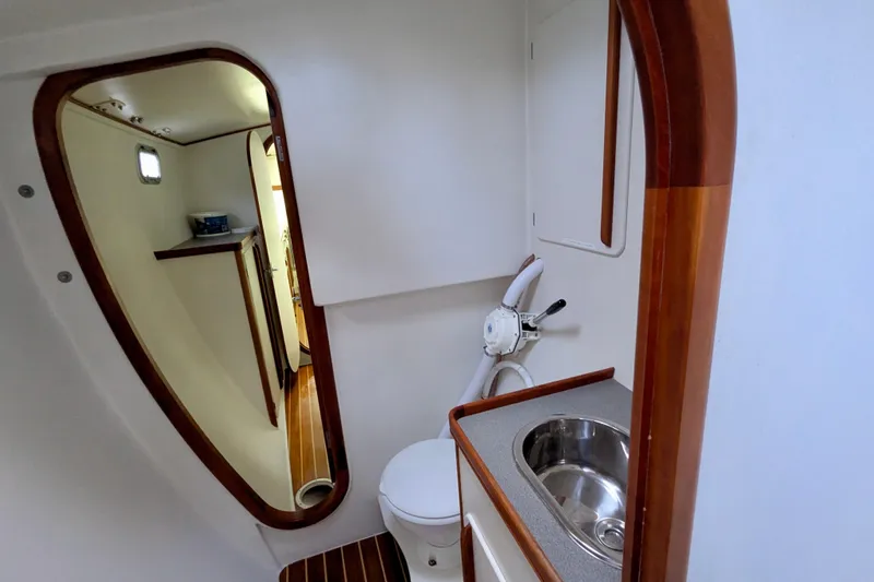 Slide: The Image of Bathroom interior of 2003 Chris White Atlantic 42 yacht, featuring sink and toilet. - 49