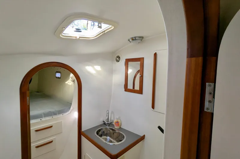 Slide: The Image of Interior of 2003 Chris White Atlantic 42 yacht with sink and cozy cabin. - 58