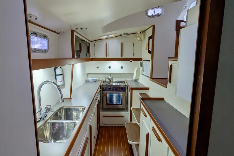 Slide: The Image of 2003 Chris White Atlantic 42 yacht kitchen with modern amenities and sleek design. - 62
