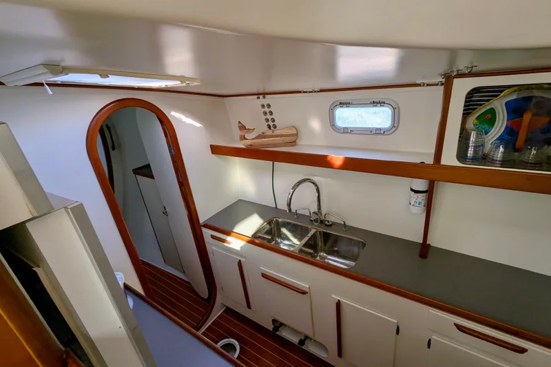 Slide: The Image of Interior of 2003 Chris White Atlantic 42 yacht, featuring a compact kitchen area. - 64