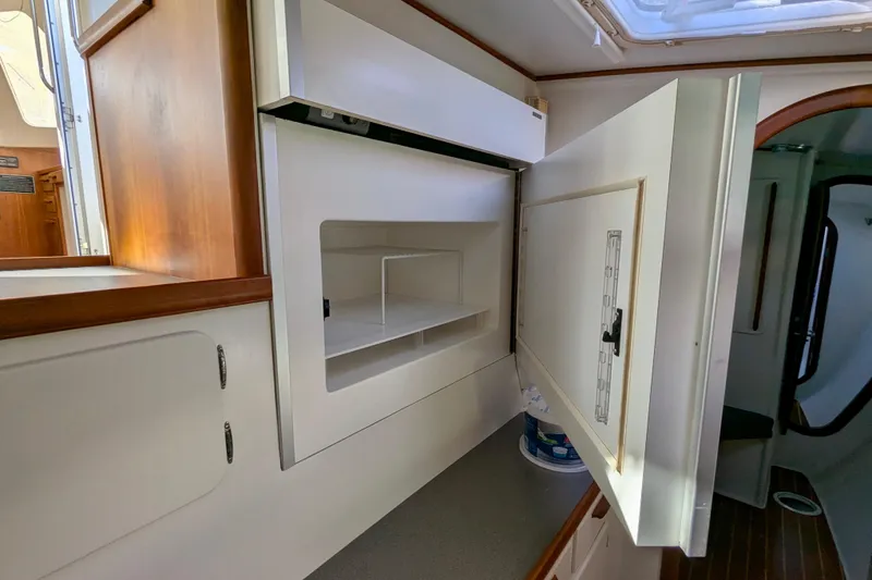 Slide: The Image of Interior of 2003 Chris White Atlantic 42 yacht showing open storage compartment. - 65