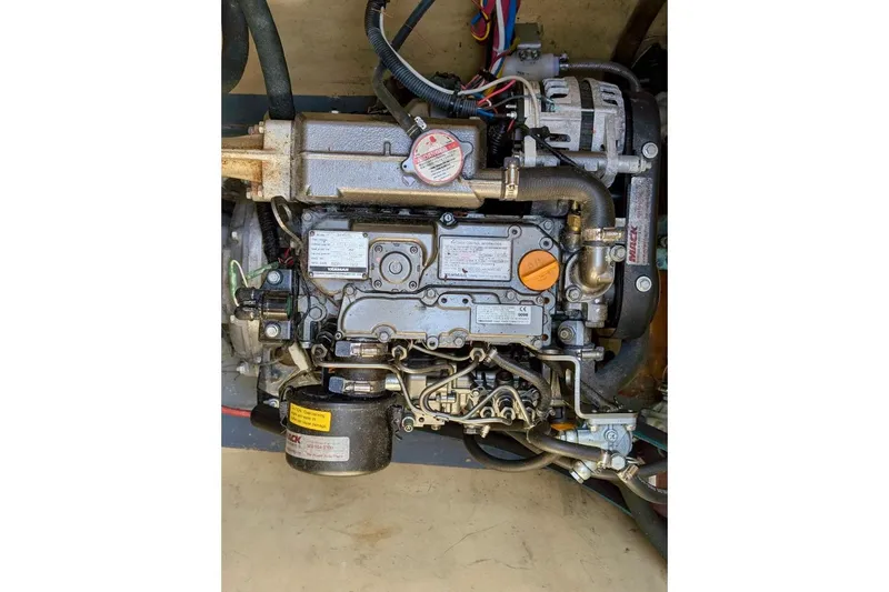 Slide: The Image of Engine of a 2003 Chris White Atlantic 42 sailboat, showcasing mechanical components. - 84