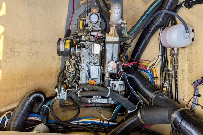 Slide: The Image of Engine compartment of a 2003 Chris White Atlantic 42 sailboat, showing detailed mechanical components. - 86