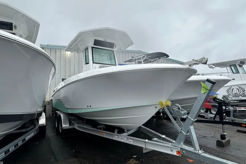 The Image of 2025 Wellcraft 223 Fisherman boat on trailer, displayed outdoors. - 1