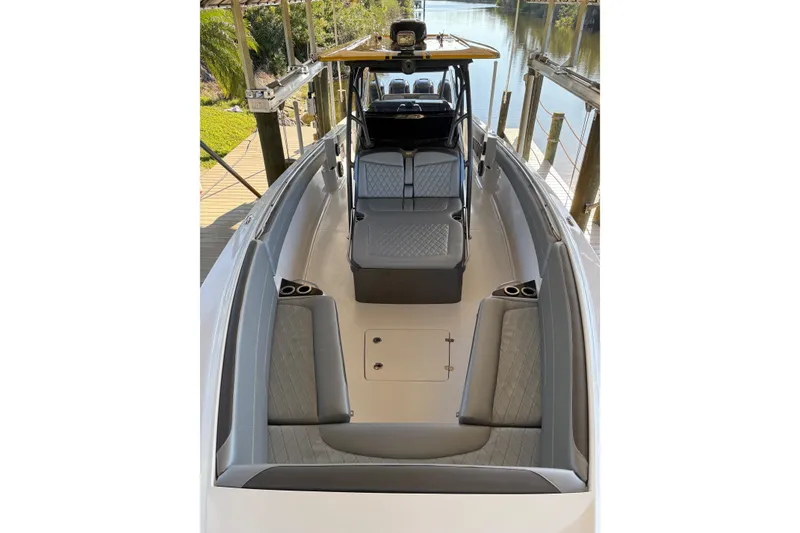 Slide: The Image of 2017 Nor-Tech 390 Sport Center Console boat with spacious seating and sleek design. - 12