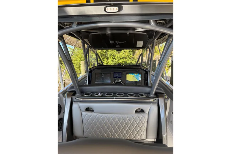 Slide: The Image of 2017 Nor-Tech 390 Sport Center Console interior with navigation screens and sleek design. - 18
