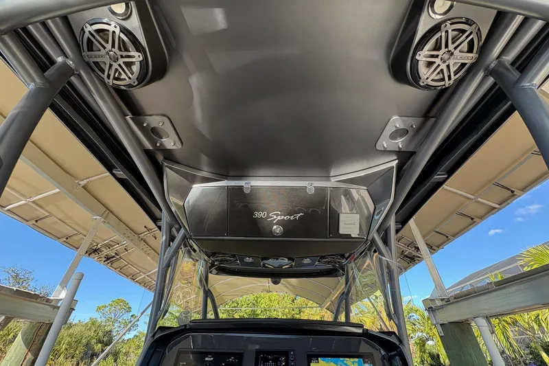 Slide: The Image of 2017 Nor-Tech 390 Sport Center Console interior with speakers and navigation equipment. - 20