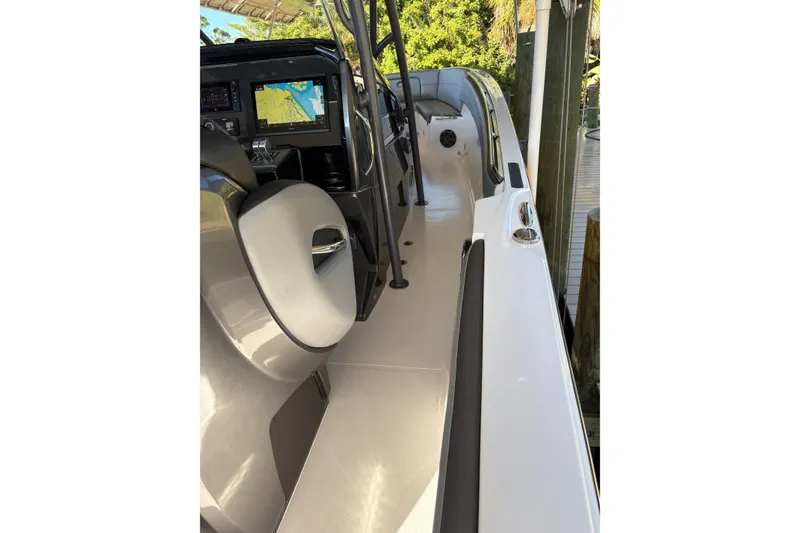 Slide: The Image of 2017 Nor-Tech 390 Sport Center Console boat interior with navigation display. - 21