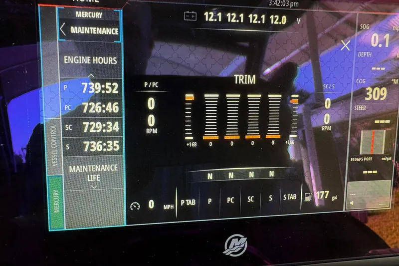 Slide: The Image of Display screen of a 2017 Nor-Tech 390 Sport Center Console showing engine hours and maintenance data. - 28