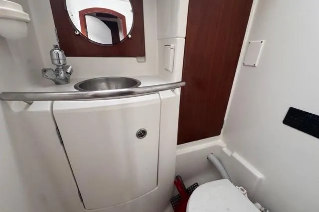 Slide: The Image of Bathroom interior of 1996 Beneteau 50 yacht with sink and mirror. - 100