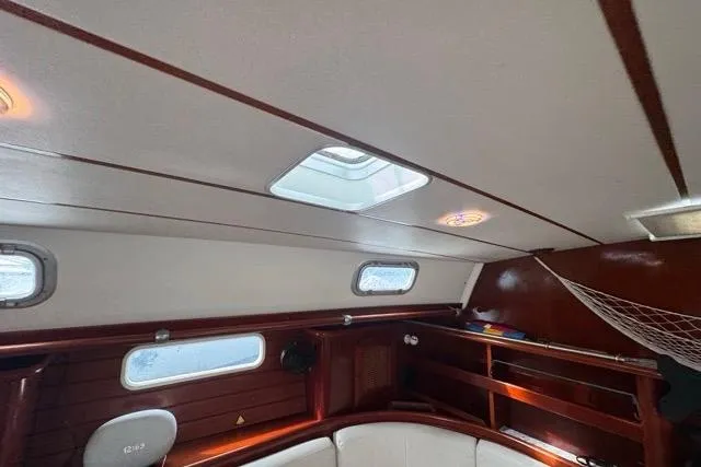 Slide: The Image of Interior of a 1996 Beneteau 50 sailboat with wooden finish and skylight. - 106