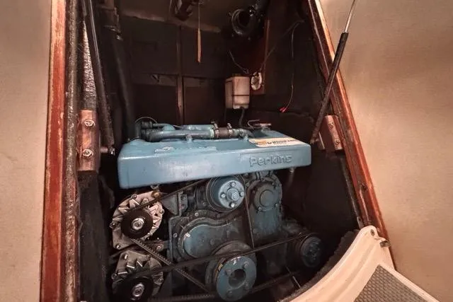 Slide: The Image of Engine compartment of a 1996 Beneteau 50 sailboat with a Perkins engine. - 111
