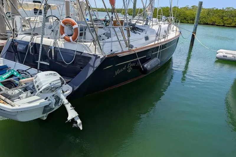 Slide: The Image of Sailboat deck view of a 1996 Beneteau 50 in a marina setting. - 19