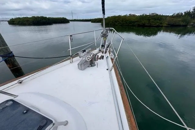 Slide: The Image of Sailboat deck view, 1996 Beneteau 50, calm waters, overcast sky. - 27