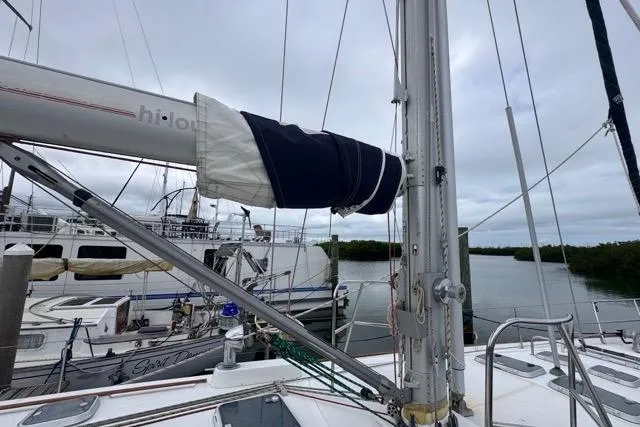 Slide: The Image of Sailboat deck view of 1996 Beneteau 50, docked with overcast sky. - 32