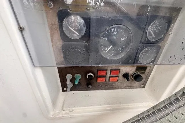 Slide: The Image of Control panel of a 1996 Beneteau 50 yacht with gauges and switches. - 41
