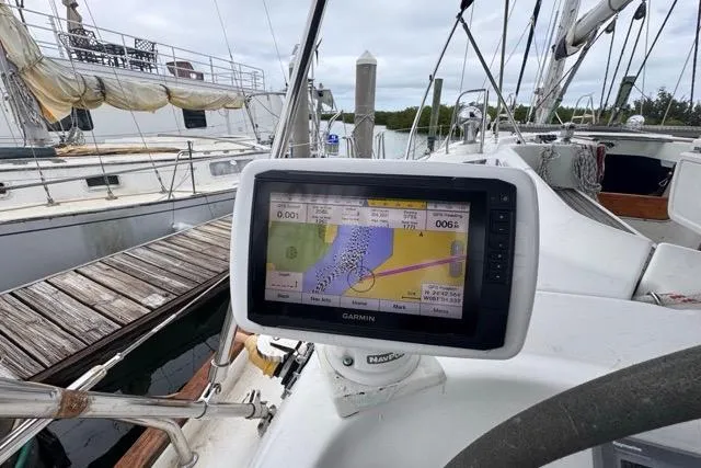 Slide: The Image of Garmin navigation system on a 1996 Beneteau 50 sailboat at a marina. - 46