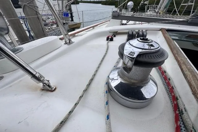 Slide: The Image of Deck of 1996 Beneteau 50 sailboat with winch and ropes in marina. - 52