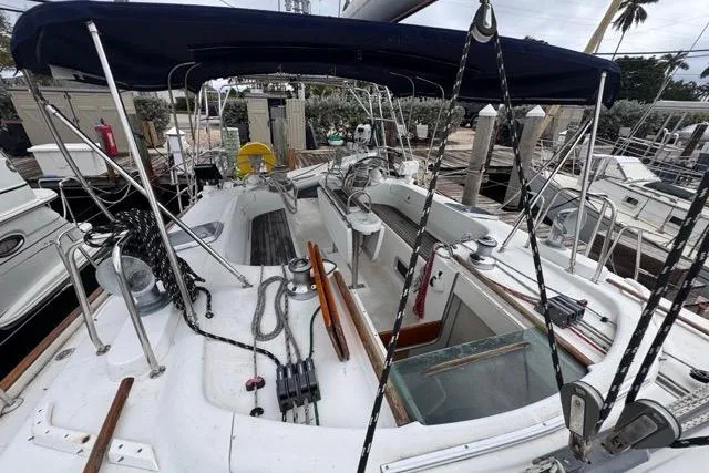 Slide: The Image of Cockpit view of a 1996 Beneteau 50 sailboat docked at a marina. - 63