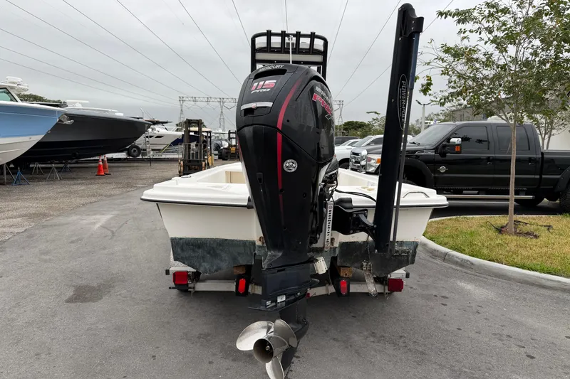 Slide: The Image of 2018 Mako Pro Skiff 19 CC Top Drive boat with Mercury engine on trailer. - 2