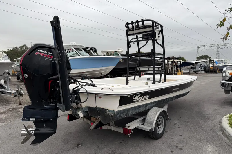 Slide: The Image of 2018 Mako Pro Skiff 19 CC Top Drive boat with Mercury engine on trailer. - 3