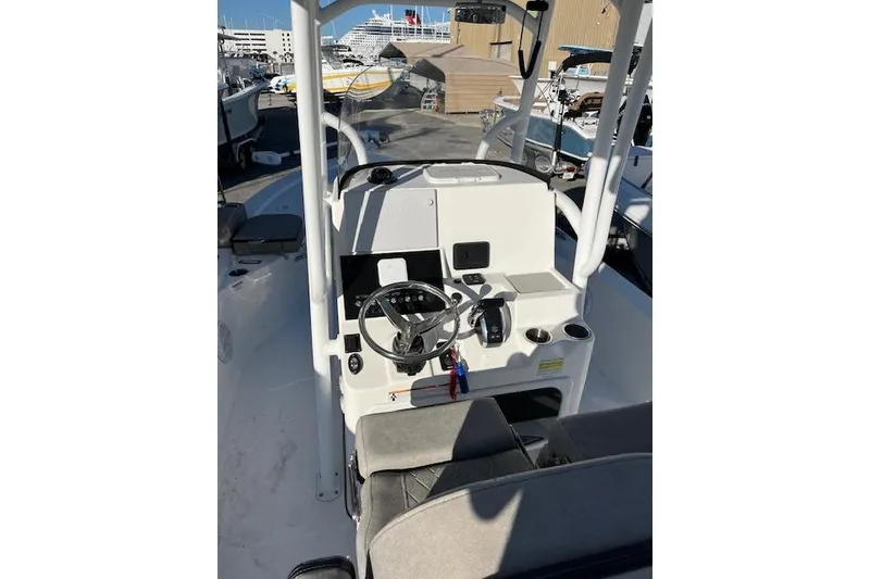 Slide: The Image of 2023 Sea Pro 248 Bay boat interior with steering console and seating. - 4