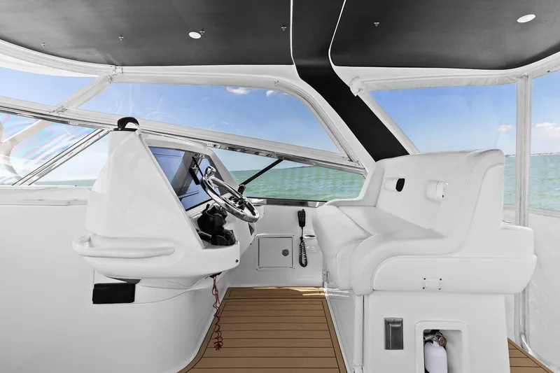 Slide: The Image of Helm of 2019 Intrepid 475 boat with advanced navigation and control systems. - 11