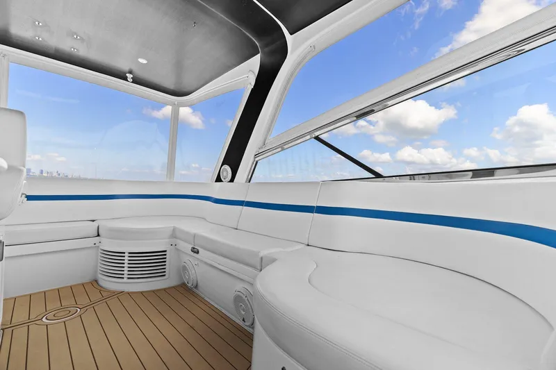 Slide: The Image of Luxurious interior of 2019 Intrepid 475 boat with plush seating and panoramic windows. - 13