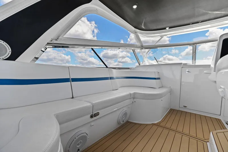 Slide: The Image of Luxurious interior of 2019 Intrepid 475 boat with sleek seating and panoramic windows. - 14