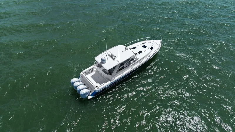 Slide: The Image of 2019 Intrepid 475 boat cruising on open water, aerial view. - 36