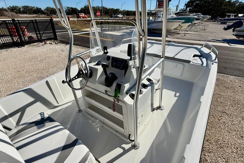 Slide: The Image of 2011 Carolina Cat 18 CC boat interior with steering console and seating. - 12