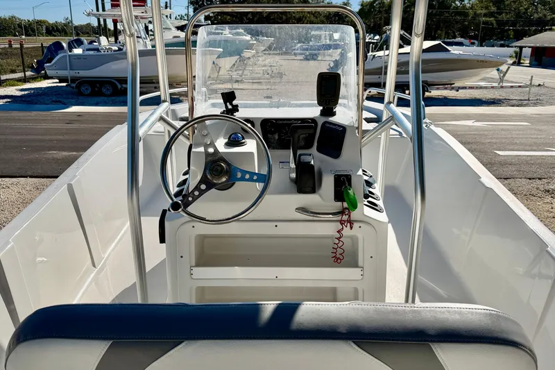 Slide: The Image of Interior view of 2011 Carolina Cat 18 CC boat with steering console. - 14
