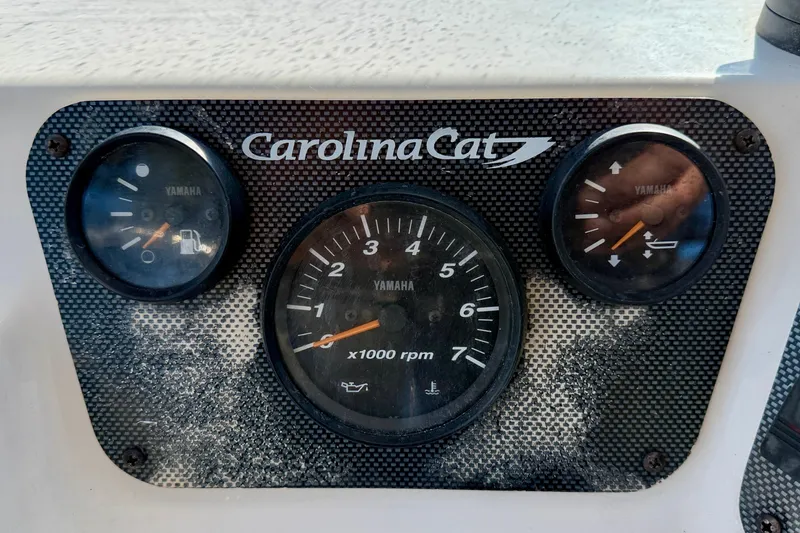Slide: The Image of Dashboard of a 2011 Carolina Cat 18 CC boat with Yamaha gauges. - 17