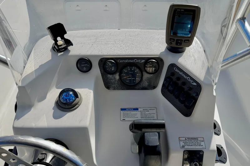 Slide: The Image of Control panel of a 2011 Carolina Cat 18 CC boat with navigation instruments. - 19