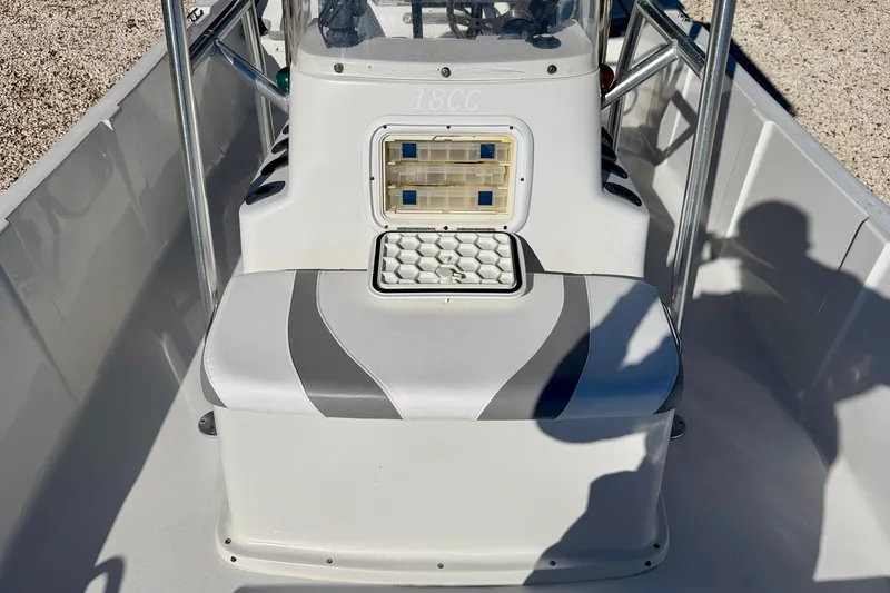 Slide: The Image of 2011 Carolina Cat 18 CC boat interior with seating and storage compartments. - 24