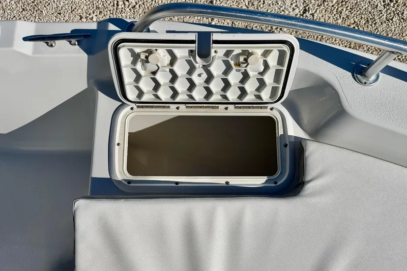 Slide: The Image of Open storage compartment on 2011 Carolina Cat 18 CC boat deck. - 26