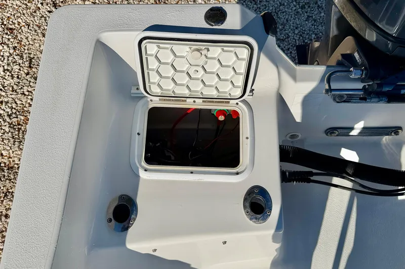 Slide: The Image of Open hatch on 2011 Carolina Cat 18 CC boat, showing interior compartment. - 28