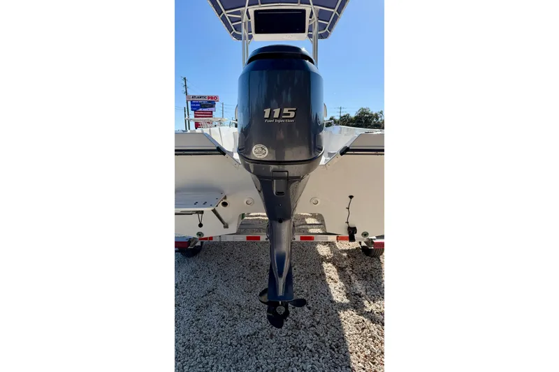 Slide: The Image of 2011 Carolina Cat 18 CC boat with 115 horsepower outboard motor, displayed on gravel. - 31