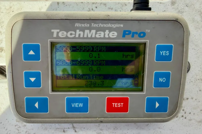 Slide: The Image of TechMate Pro device displaying RPM and run time data for Carolina Cat 18 CC, 2011 model. - 33